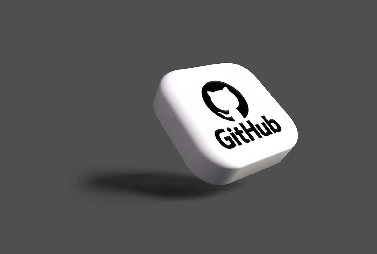 A 3D GitHub logo on a white dice
